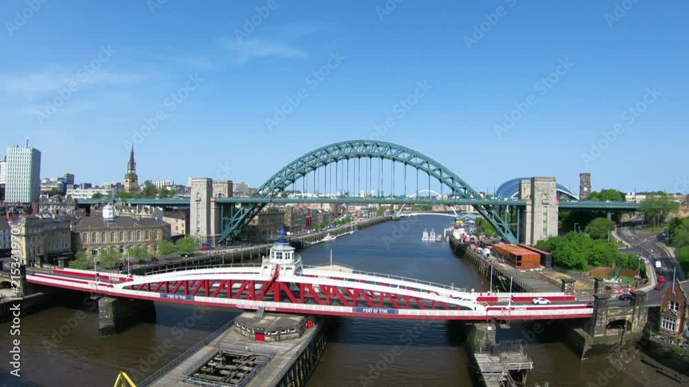 Tyne Bridges. The view from the High Level Bridge over the River Tyne looking towards the Swing and Tyne Bridges. The bridges connect Newcastle upon Tyne and Gateshead in North East England. Tyne Bridges. The view from the High Level Bridge over the River Tyne looking towards the Swing and Tyne Bridges. The bridges connect Newcastle upon Tyne and Gateshead in North East England.