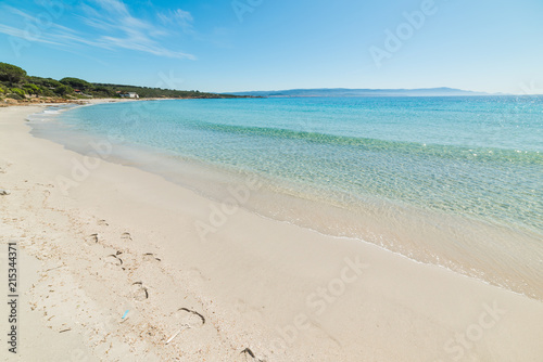 Turquoise water and white sand in Le Bombarde beach in Alghero