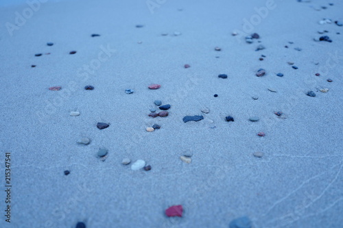 Fototapeta Naklejka Na Ścianę i Meble -  Small pebbles on a sandy beach. Beach Amber. Kaliningrad region. Russia.
