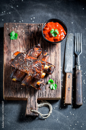 Spicy and tasty roasted ribs with vegetables and potato