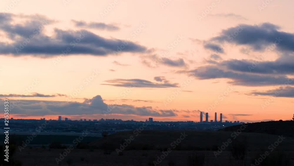 Dramatic and colorful sunset on Madrid’s skyline and the four towers on a cloudy day. Dramatic and colorful sunset on Madrid’s skyline and the four towers on a cloudy day.