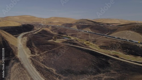 Aerial footage of a 650 acre fire started in the Altamont hills between Tracy and Livermore in California. photo
