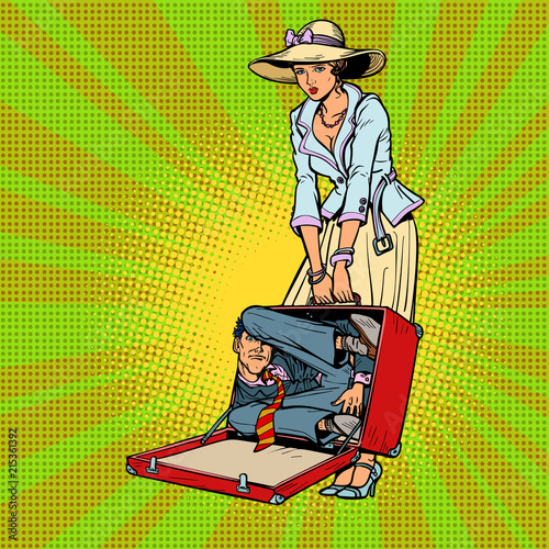 Husband in suitcase. Woman traveler