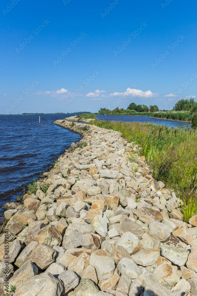 Fototapeta premium Small dike at the Schildmeer lake in Groningen, Netherlands