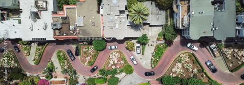 Panorama view aerial Lombard Street, an east–west street in San Francisco, California. Famous for steep, one-block section with eight hairpin turns. Crookedest, steep hills, sharp curves, one-way road