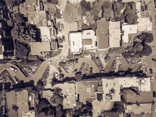Vintage tone aerial Lombard Street, an east–west street in San Francisco, California. Famous for steep, one-block section with eight hairpin turns. Crookedest, steep hills, sharp curves, one-way road