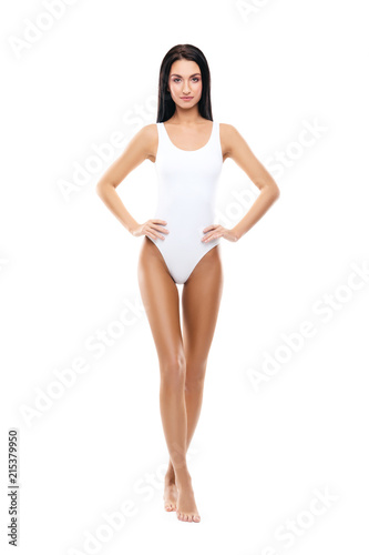 Fit and sporty girl in white swimsuit. Sport, fitness, diet, weight loss and healthcare concept.