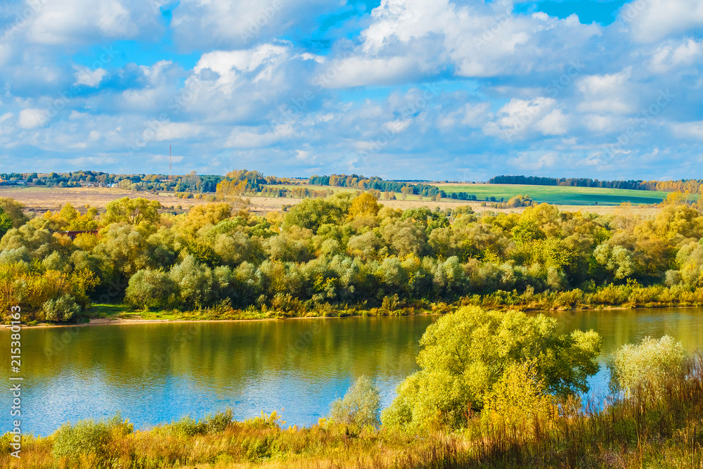Picturesque autumn landscape. Yellow trees on a blue sky Picturesque autumn landscape. Yellow trees on a blue sky