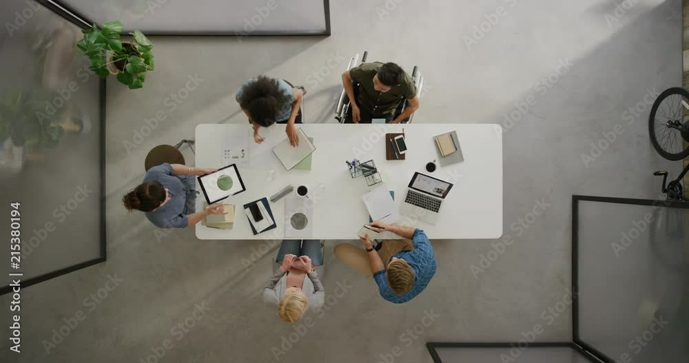 creative multi ethnic business people in boardroom meeting sharing ideas planning creative strategy for corporate project in disabled friendly office top view