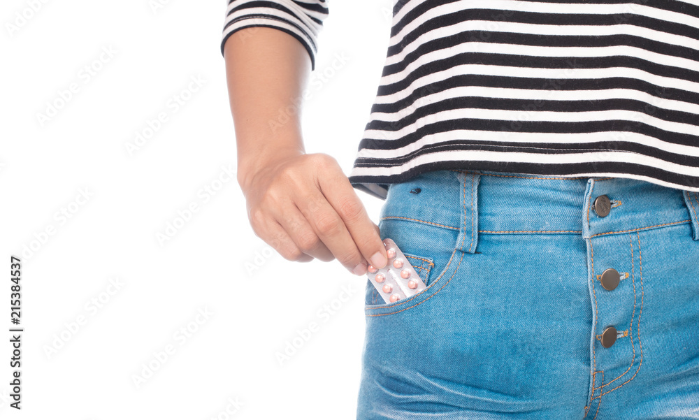 hand grabbing birth control pill in the pocket of blue jeans isolated on  white background Stock Photo | Adobe Stock