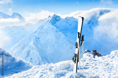 Winter mountains and ski equipment in the snow. Winter holidays in ski resort