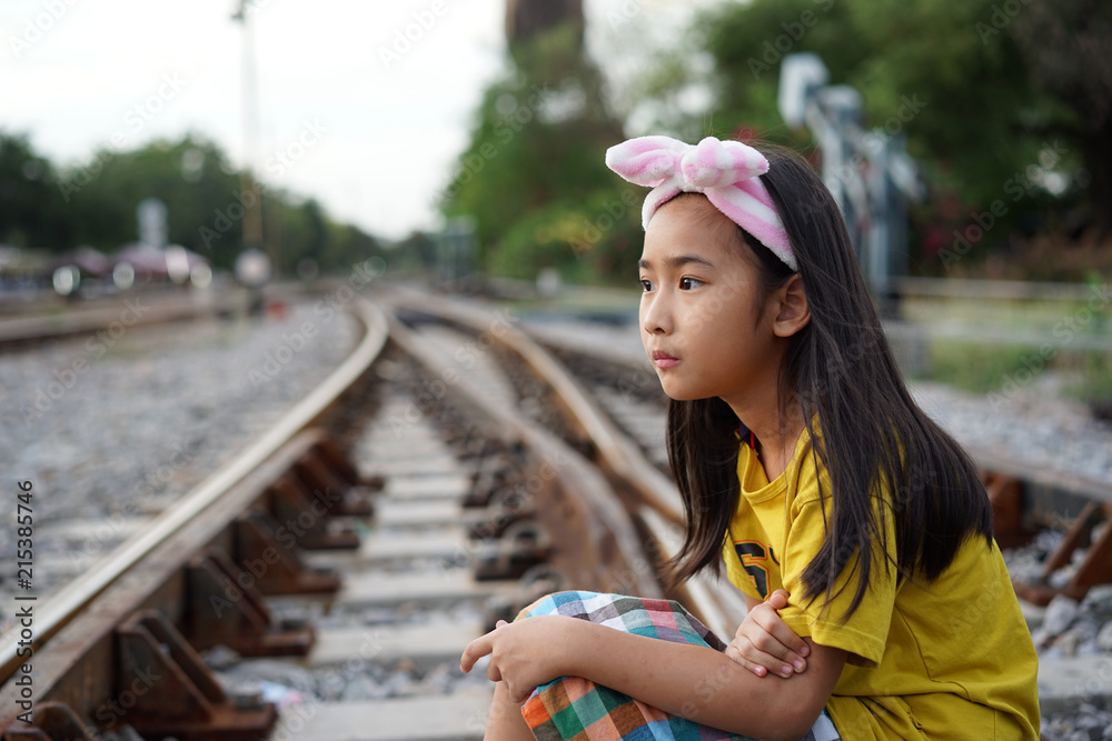 Fototapeta premium Portrait Asian cute little girl Railway background