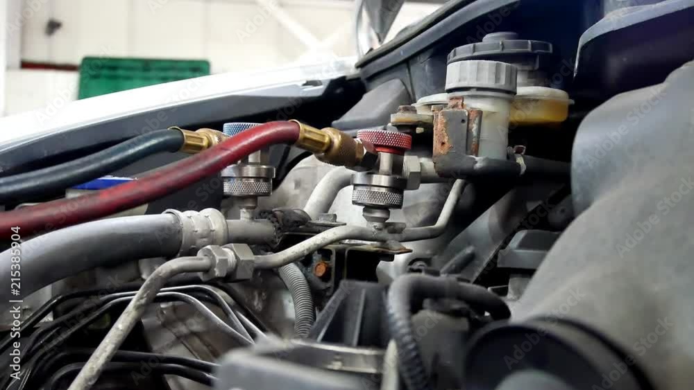 custom made wallpaper toronto digitalMechanic adjusting air conditioning hoses at a garage