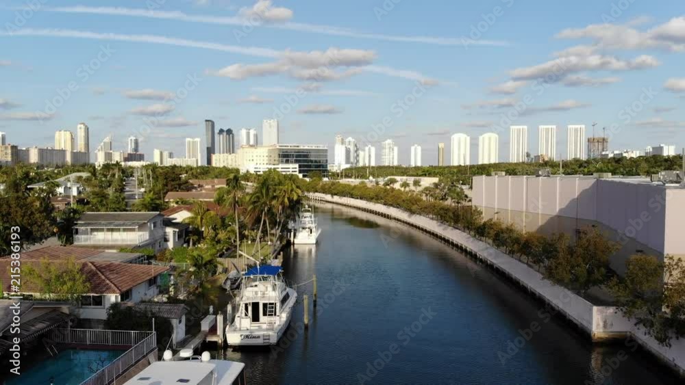 Miami water canal aerial view. urban setting, buildings and houses. Miami water canal aerial view. urban setting, buildings and houses.