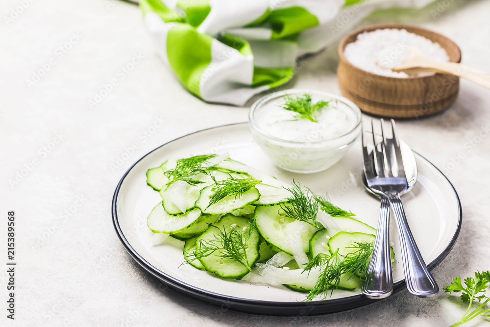 Vegetarian low calorie cucumber and fennel salad with yogurt dressing. Top view, space for text. Vegetarian low calorie cucumber and fennel salad with yogurt dressing. Top view, space for text.