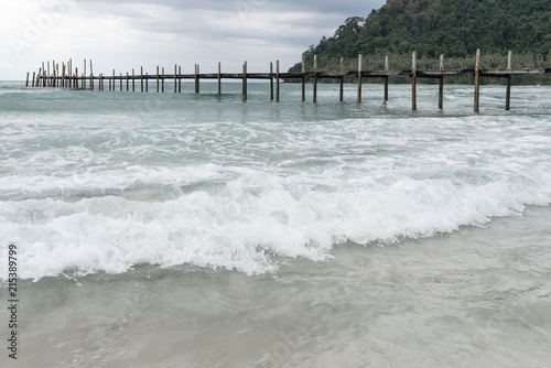 Sea bridge at koh kood island with sea wave foreground 