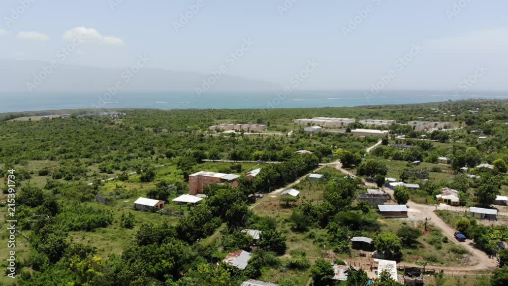 An aerial view of the Dominican Republic, with a water supply truck on the right, making his rounds.