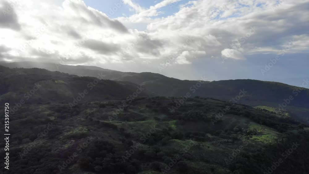 An epic aerial shot of an island jungle, revealing the mountains. Shot in the Dominican Republic. An epic aerial shot of an island jungle, revealing the mountains. Shot in the Dominican Republic.