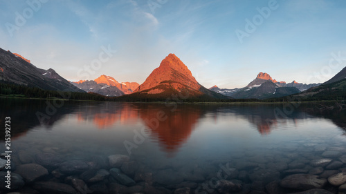 Swiftcurrent Lake with Reflection of Mountain Sunrise © nat693