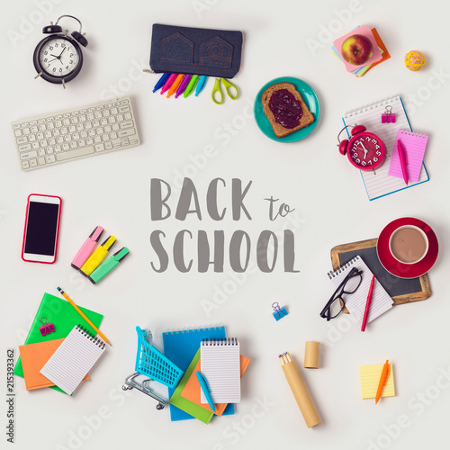 Back to school concept with school supplies on white background. View from above. Flat lay