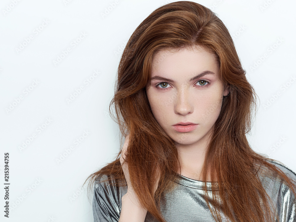 Young beautiful excited woman with gorgeous natural red hair green eyes, blank copy space on white background for advertisement or promotional text Young beautiful excited woman with gorgeous natural red hair green eyes, blank copy space on white background for advertisement or promotional text