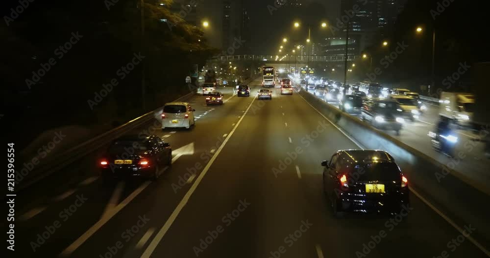 Driving through HongKong city centre in heavy traffic on the evening Driving through HongKong city centre in heavy traffic on the evening