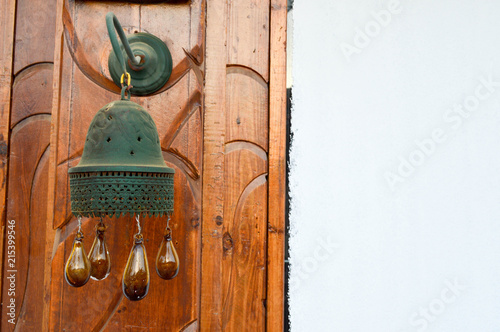 The edges of the Egyptian traditional bell tower bell on the building with brown glass balls are dripping. Arab Islamic Islamic decoration of buildings photo