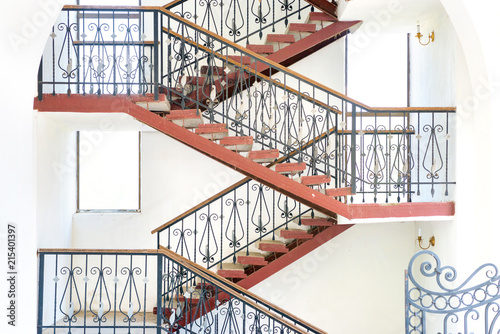 Ramp and staircases that turns inside a building, details of modern urban house