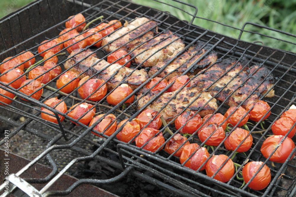 pork with cherry tomatoes on grill