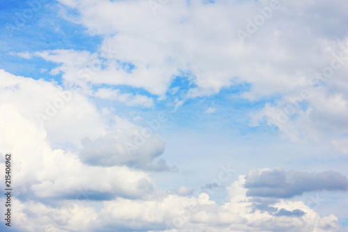 Clouds in Blue Sky Summer Nature Wallpaper. Fluffy Sky Background Cloudscape with Many Stormy Clouds. Scenic View of Blue Pale Light Sky  Cloudy Weather Climate Image.