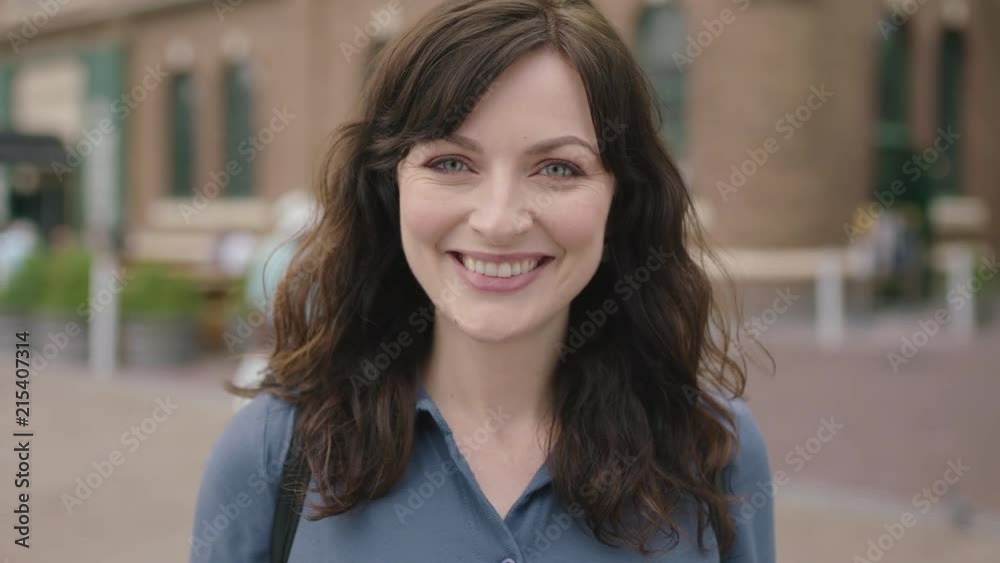 portrait of lovely elegant independent woman smiling happy confident on urban sidewalk portrait of lovely elegant independent woman smiling happy confident on urban sidewalk