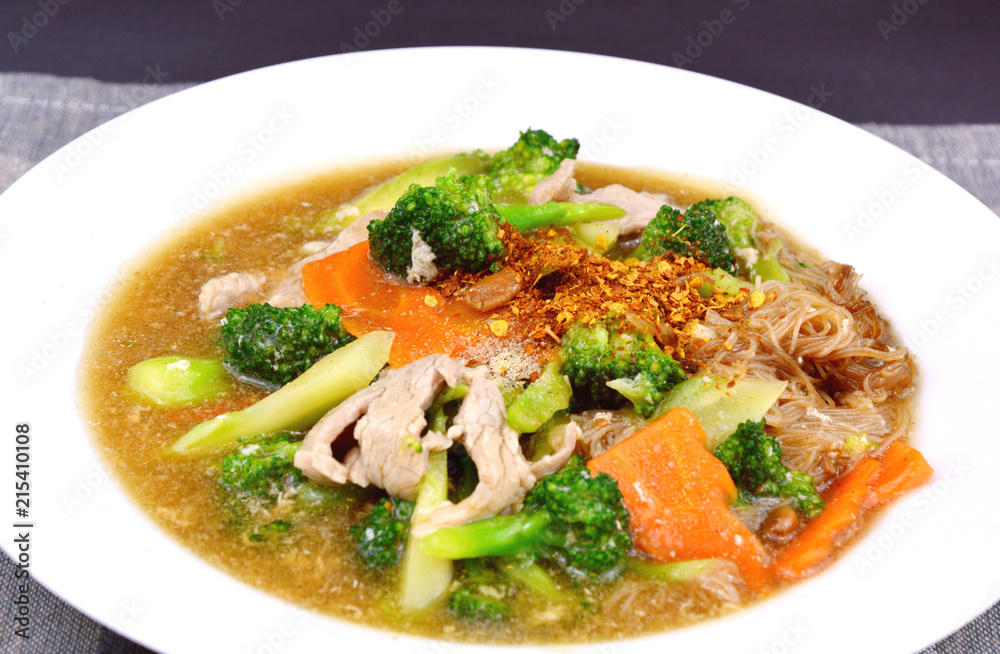 pork and Broccoli and carrot in thick gravy with thin rice noodles pork and Broccoli and carrot in thick gravy with thin rice noodles