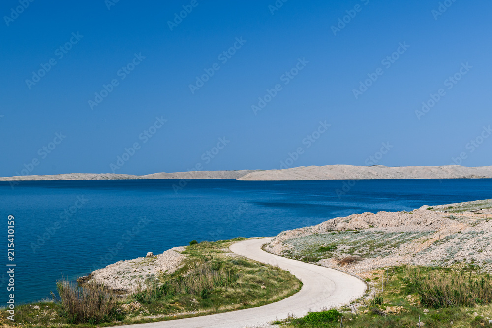 Concept picture of road trip in Croatia with scenic view by the sea at pag island in Croatia,