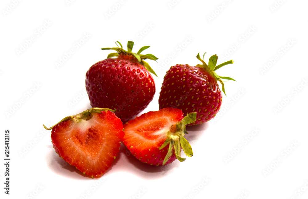 Strawberry with sliced half and leaves isolated on white background with clipping path. Strawberry whole and cut into halves. Close-up. Red strawberries. Strawberry with sliced half and leaves isolated on white background with clipping path. Strawberry whole and cut into halves. Close-up. Red strawberries.