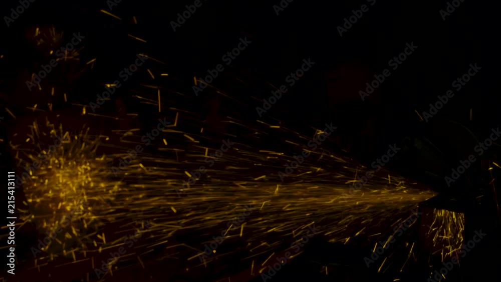 sparks effect - worker cutting iron