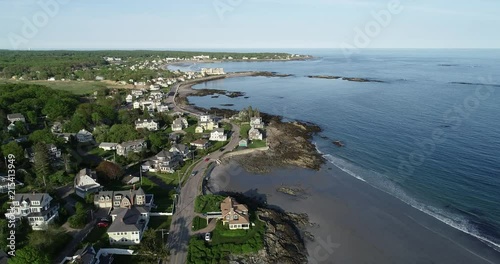 Cars commuting along the coastline.