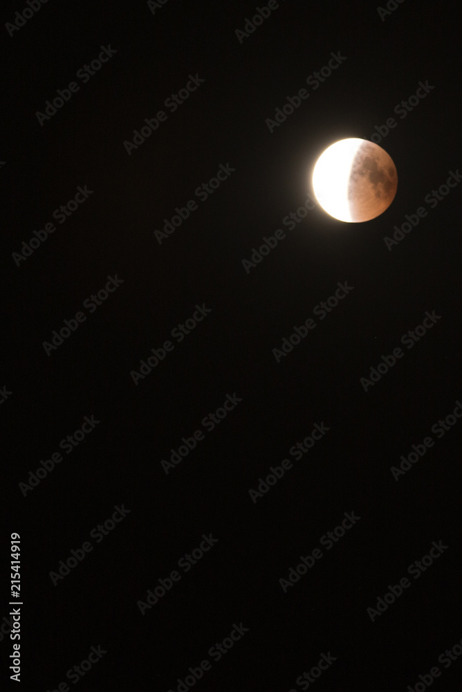 longest lunar eclipse of the century. The moon on the black sky. rare astronomical phenomenon longest lunar eclipse of the century. The moon on the black sky. rare astronomical phenomenon