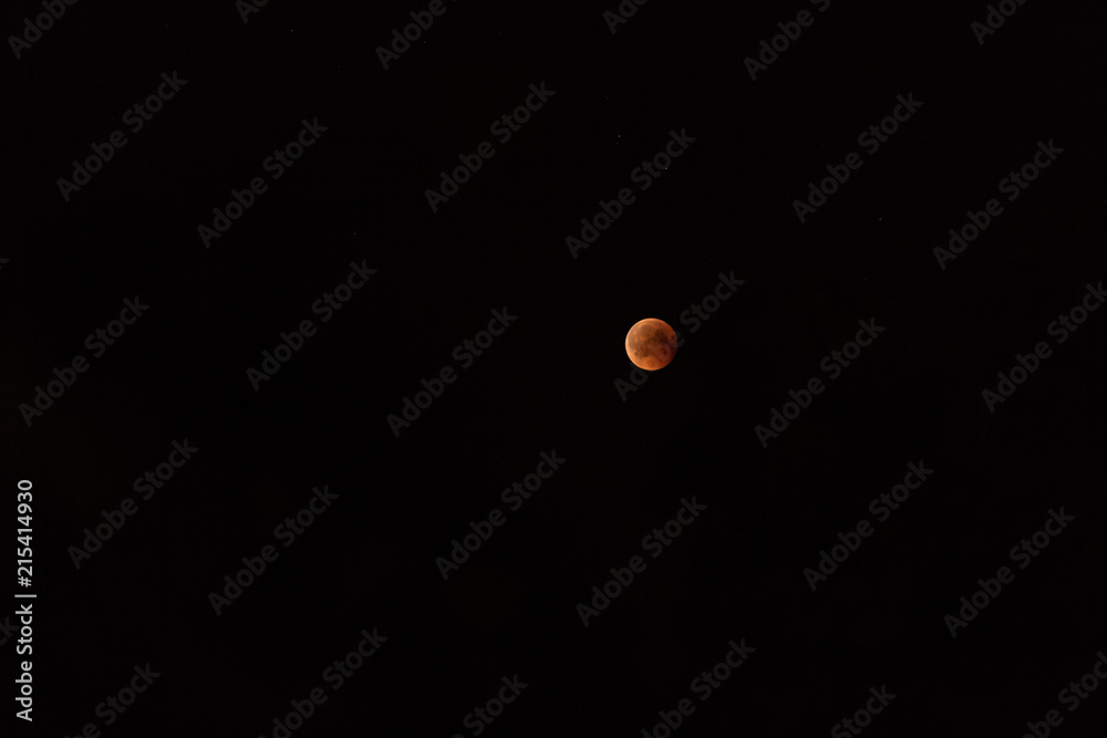 longest lunar eclipse of the century. The moon on the black sky. rare astronomical phenomenon longest lunar eclipse of the century. The moon on the black sky. rare astronomical phenomenon
