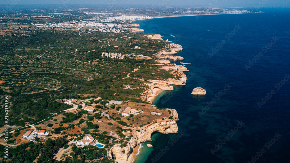 Above view of beautiful beaches of Algarve coastline in Portugal. Coastline from above.