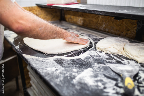 Close up shot of pizza making or preparing process
