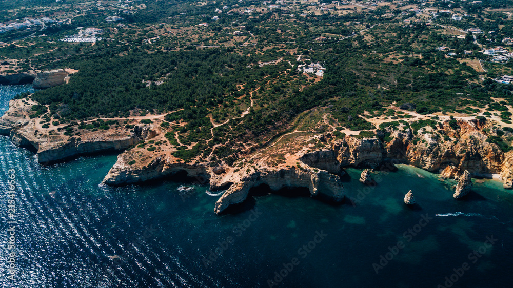 Beautiful rocks and cliff beaches of Algarve, Portugal coastline from above.