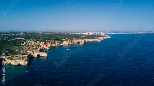 Aerial view of Algarve coast. Beautiful natural beaches with cliff and rocks from above © F8  \ Suport Ukraine