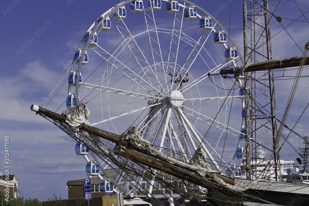 Ferris wheel (skywheel) and bowsprit of sailing ship in Helsinki, Finland