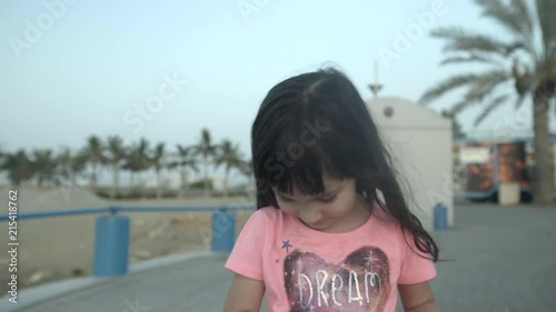 4K girl smiling by the beach photo