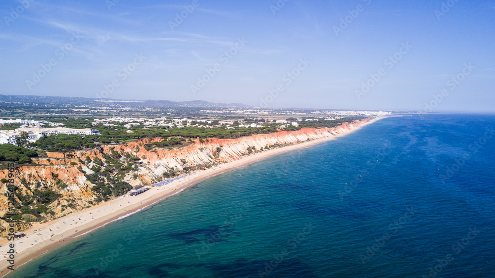 Aerial view of Algarve Beach. Beautiful Falesia beach from above in Portugal. Summer vocation in Portugal.