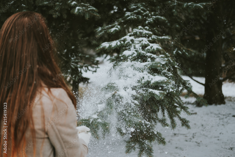 Girl in winter forest