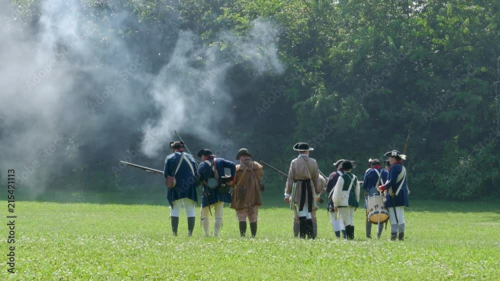 Amercian Revolutionary War Reenactors fire at enemy Amercian Revolutionary War Reenactors fire at enemy