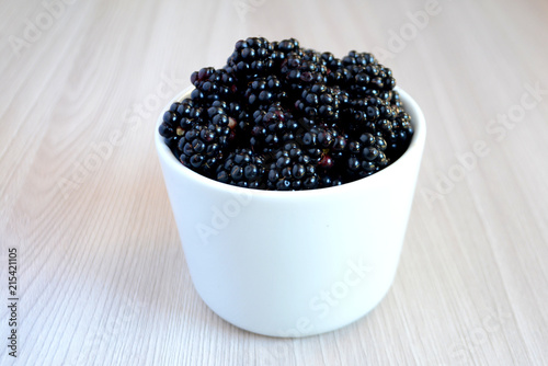 Blackberry in the cup. Summer berry