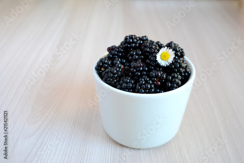 Blackberry in the cup. Summer berry