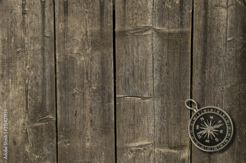 compass on an old wooden background